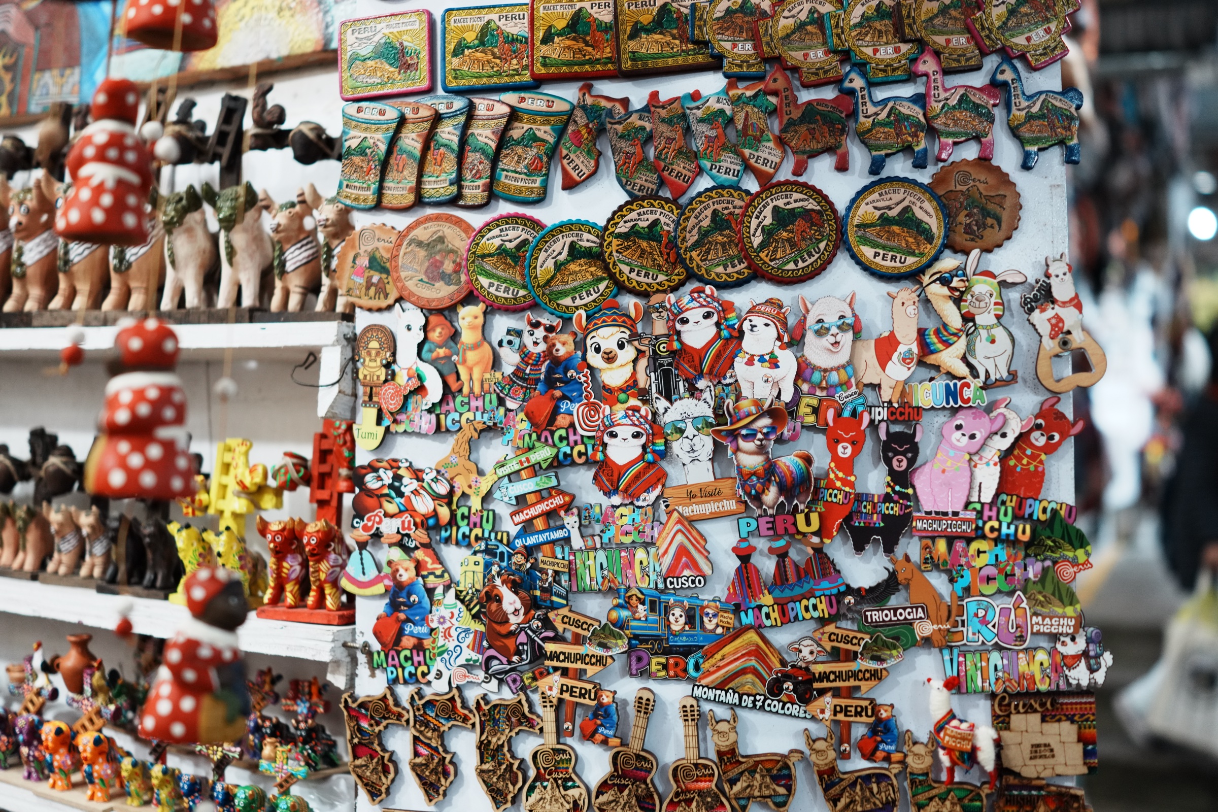 A dense display of illustrated shirts and souvenirs near Machu Picchu